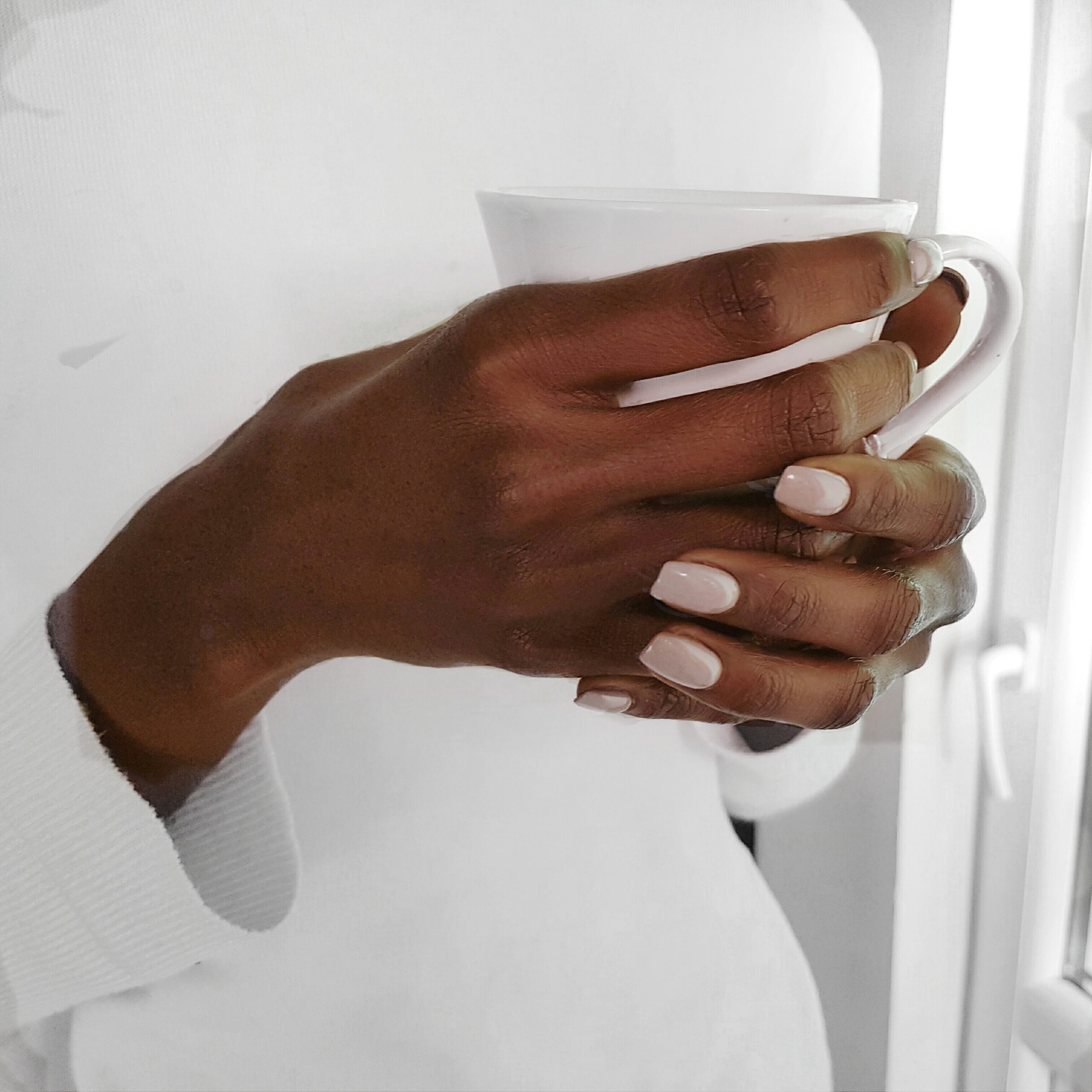 midsection-woman-holding-coffee-cup-min-1-scaled-1.jpg